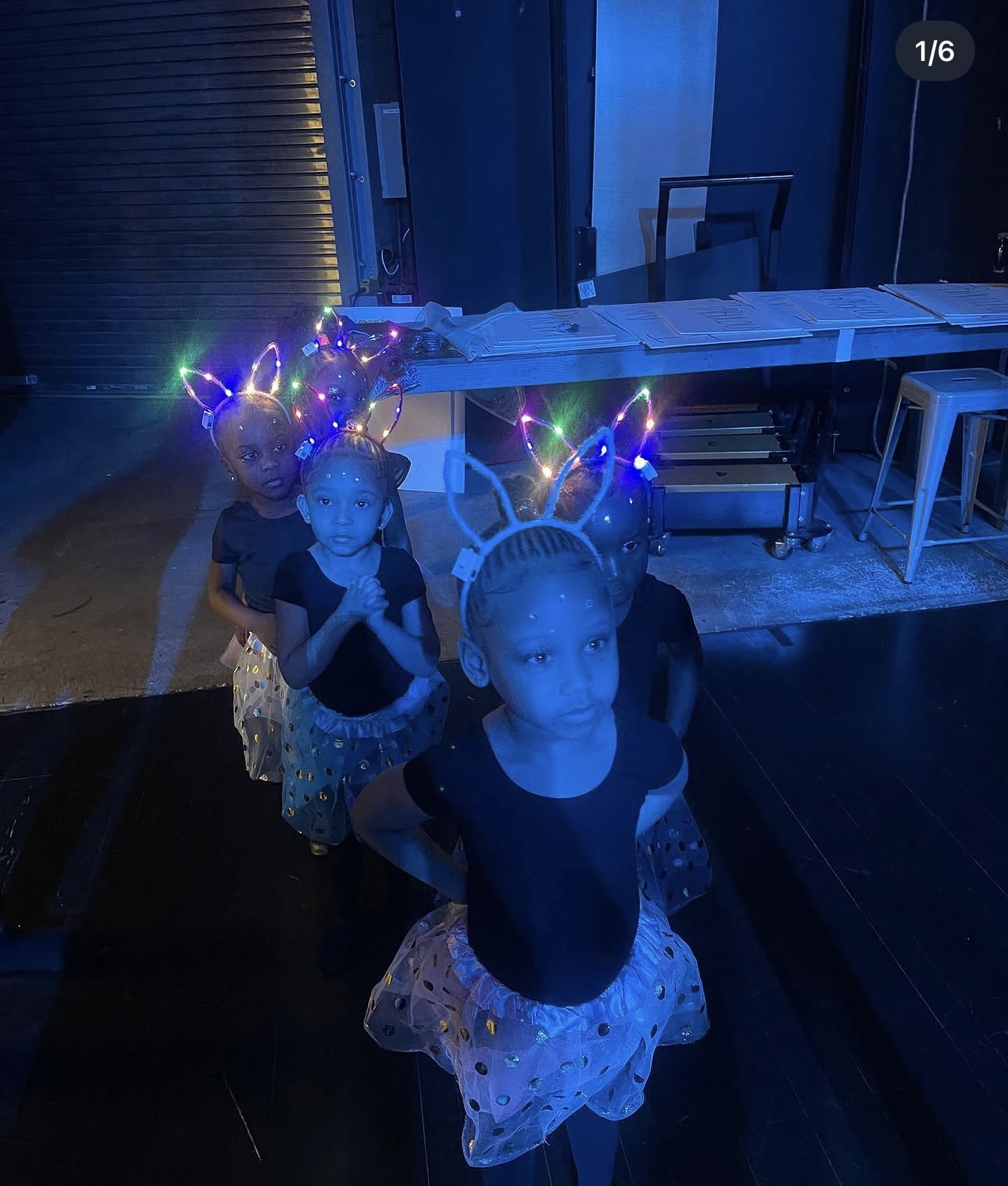 Dancers backstage with light-up headbands